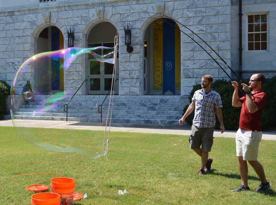 Emory physicists making a giant soap bubble.