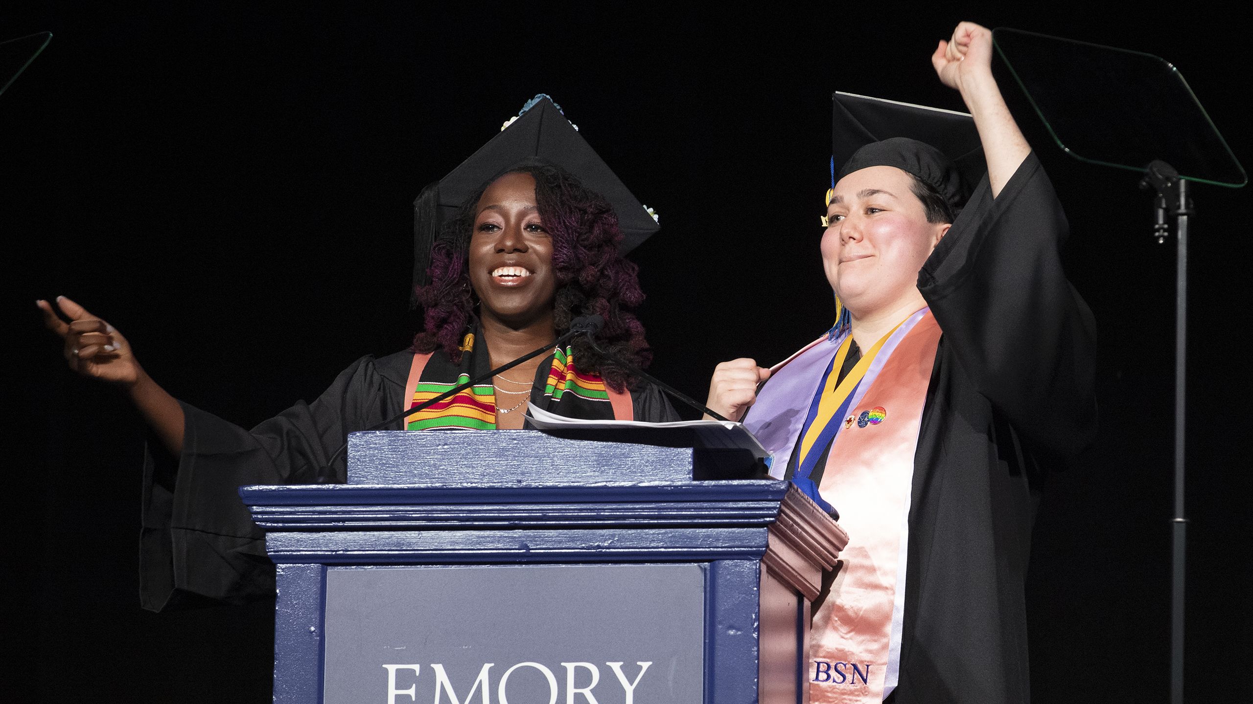 Two female students at the podium