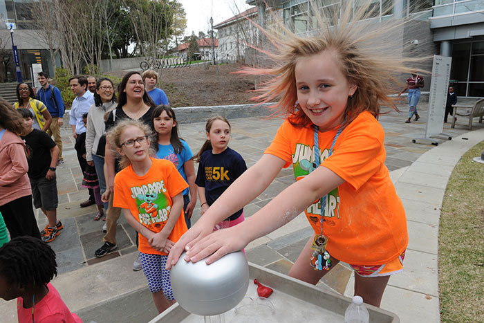A young girl participates in a demonstration at the 2017 Atlanta Science Festival.