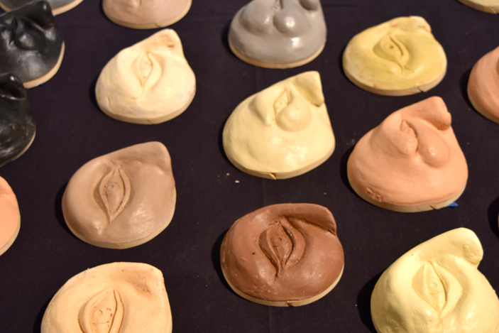Small sculptures show close-ups of women's faces. Every fourth sculpture illustrates abuse.