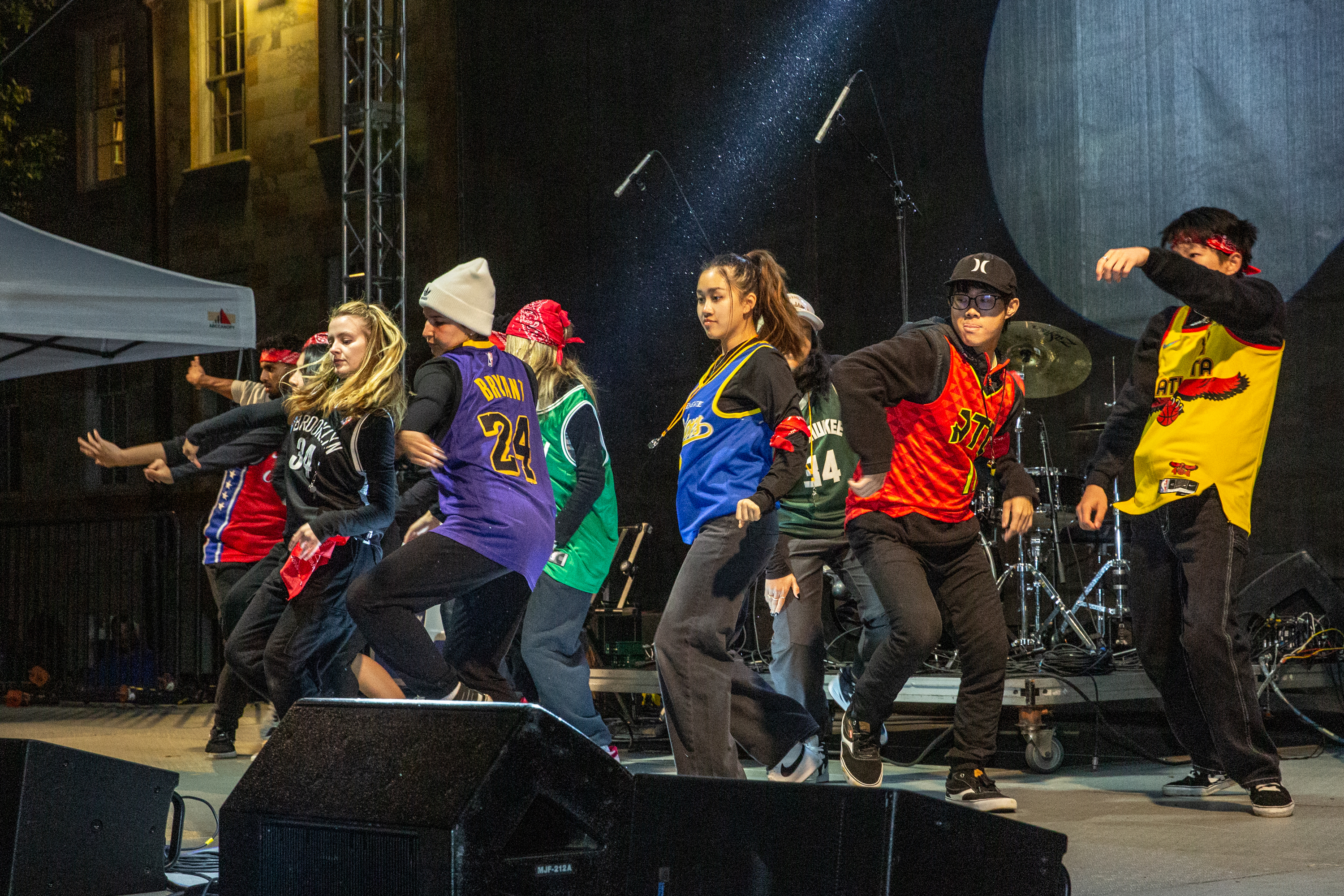 Students on stage in jerseys